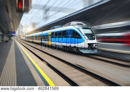 High Speed Train In Motion On The Railway Station At Sunset