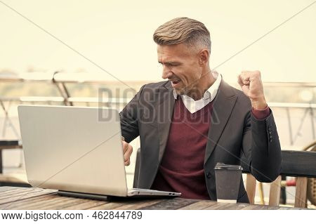 Got The Job Done In Time. Happy Man Check Watch And Laptop. Punctuality. Manager Make Winning Geture