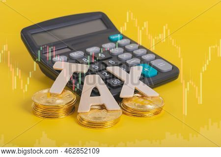 Tax Btc Cryptocurrency With Tax Wording On Bitcoin And Caculator On Stock Graph Yellow Background