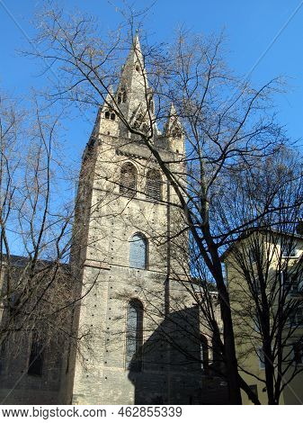 Collegiale Saint-andre (grenoble). Catholic Church Against The Blue Sky And Tree Branches. France