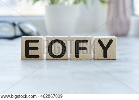 Eofy, End Of Financial Year Text. Wood Cubes And White Background.