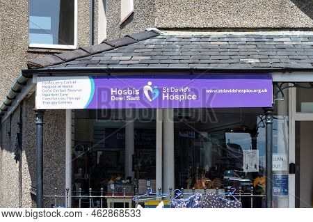 Harlech, Uk- July 13, 2022: The Sign For St David's Hospice Store In The Village Of Harlech In North