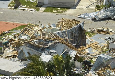 Hurricane Ian Destroyed House In Florida Residential Area. Natural Disaster And Its Consequences
