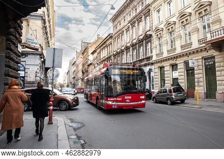 Budapest, Hungary - February 27, 2022:  Budapest Trolleybus, Or Trolley, Passing By A Street Of City