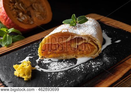 Strudel With Pumpkin And Mint, On A Dark Background