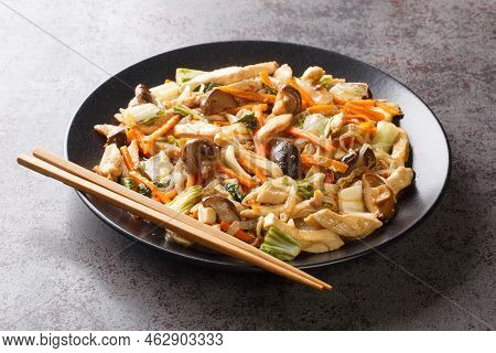Delicious Stir-fry Of Tender Chicken And Crunchy Vegetables, Chop Suey Close-up In A Plate On The Ta