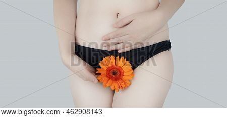 Virginity. Menstruation. Critical Days. Concept Photo. The Girl Holds A Flower In The Crotch Area, S