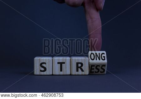Strong Stress Symbol. Doctor Turns A Wooden Cube With Concept Words Strong Stress. Beautiful Grey Ta