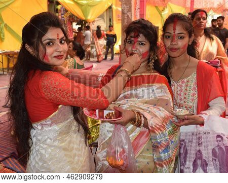 Delhi - India
5th Oct 2022
Happy Bengali Ladies In Tradition Attire Offering Sweets To Each Other Du
