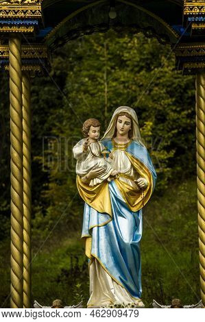 A Statue Of Virgin Mary In Ukrainian Village Sheshory, Ivano-frankivsk Region Of Ukraine
