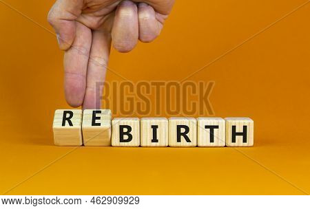 Birth Or Rebirth Symbol. Businessman Turns Wooden Cubes And Changes The Word Birth To Rebirth. Beaut