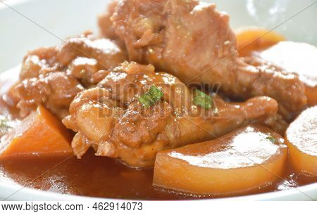 Boiled Chicken Leg With Potato In Swet Red Gravy Sauce Stew On Plate