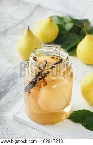 Canned Pear Compote With Vanillin. Pear Compote. Homemade Delicious Canned Pear Compote In Glass Jar
