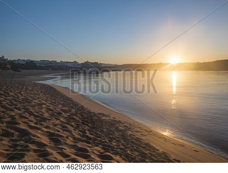 Orange Sunrise At Empty Sand Beach Praia Da Franquia At Vila Nova De Milfontes With Mira River And F