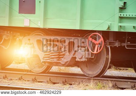 Steel Wheelset Of Railway Cars On Rails.bright Solar Illumination