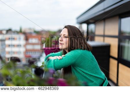 Portrait Of An Attractive Thirty Year Old White Woman Posing On A Terrace, Belgium