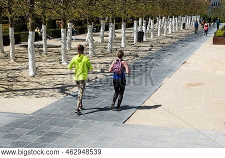 Brussels City Center, Brussels Capital Region - Belgium - 05 01 2021 Two Girls Jogging In The Park O