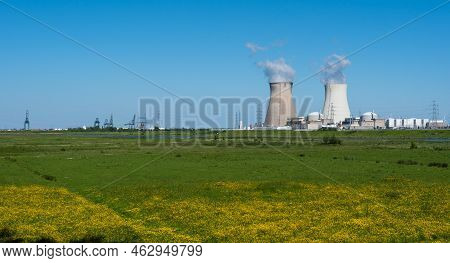 Doel, East - Flanders - Belgium - 06 01 2021 Cooling Towers Of The Nuclear Power Reactors With Agric