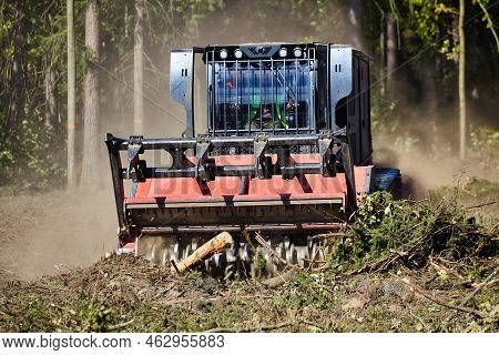 Forest Mulcher That Cleans The Soil In The Forest. Tracked General Purpose Vehicles Used For Vegetat