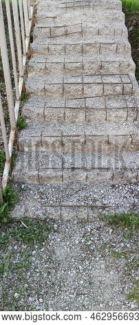 Dilapidated Steps Of A Concrete Staircase. An Old Concrete Staircase With Railings, The Steps Collap