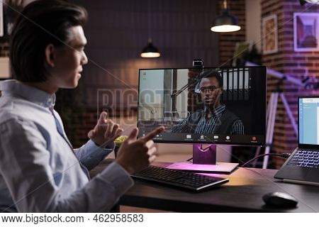 Office Worker Talking To Manager On Videocall, Using Webcam On Computer And Attending Online Busines