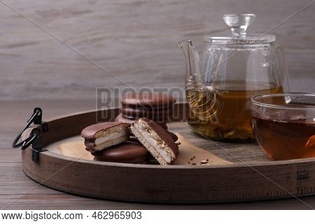 Tasty Choco Pies And Tea On Wooden Tray
