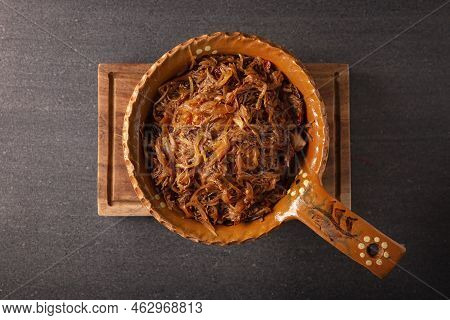 Tinga De Res. Typical Mexican Dish Prepared Mainly With Shredded Beef, Onion And Dried Chilies. It I