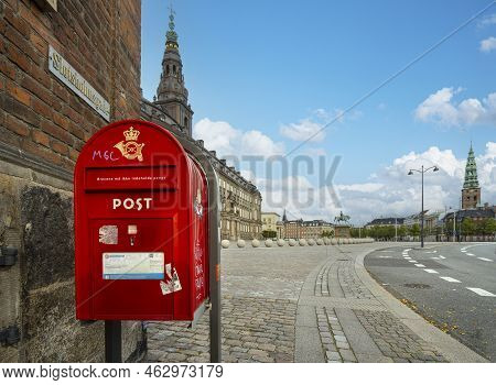 Copenhagen, Denmark. October 2022. The Red Postbox In A Square In The City Center