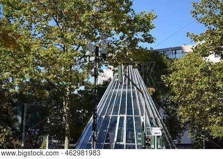 Frankfurt Am Main, Germany - 09 30 2002: Glass Pyramid Between Tress In Frankfurt