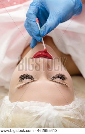 Closeup Of Young Caucasian Woman Face, Lips And Eyebrows During A Process Of Permanent Lips Makeup I