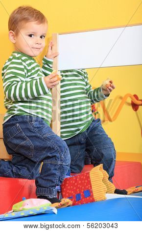 Cute caucasian toddler in kindergarten.