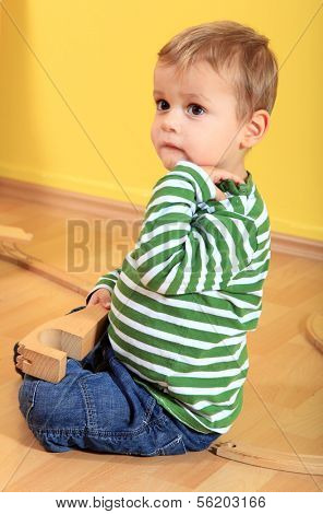 Sad toddler in kindergarten.