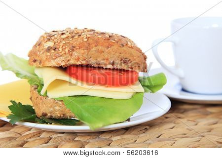Fine served multi-grain roll with cheese. All on white background.
