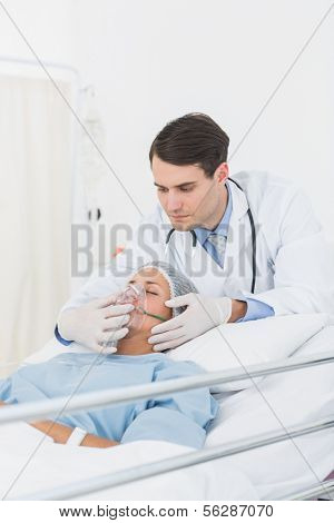 Young female patient receiving artificial ventilation in the hospital