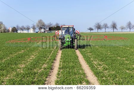 Tractor On Field Sputtering Pest Protection