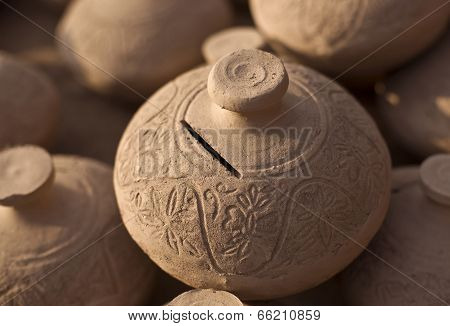 Traditional handmade clay moneybox