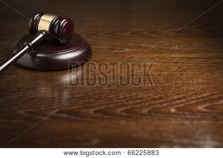 Dark Wooden Gavel Abstract on Table with Room for Text.
