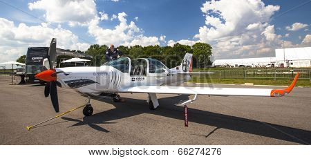 BERLIN, GERMANY - MAY 20, 2014: Two seated training and aerobatic low-wing aircraft Grob G120 TR (Germany), demonstration during the International Aerospace Exhibition ILA Berlin Air Show.