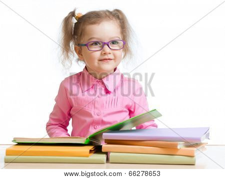 child girl in glasses reading book 