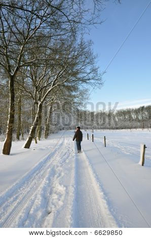 Senior Woman Walking In A Winter Wonder Land