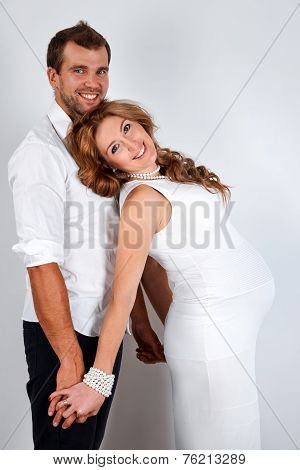 Happy Pregnant Couple on white background