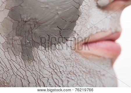 Skin Care. Woman Applying Clay Mask On Face. Spa.