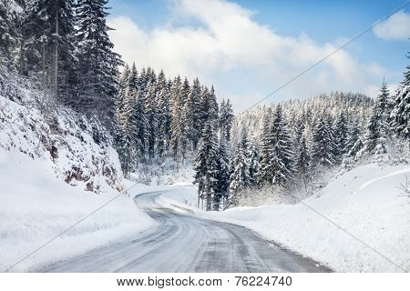 Empty snow covered road
