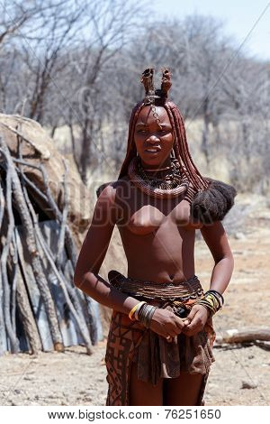 Himba Woman With Ornaments On The Neck In The Village