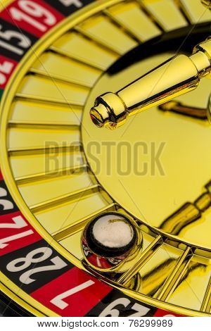 the cylinder of a roulette gambling in a casino. winning or losing is decided by chance.
