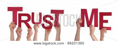 People Hands Holding Red Word Trust Me