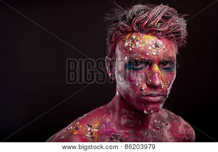 Creepy portrait of a halloween man with bloody body art and face art.