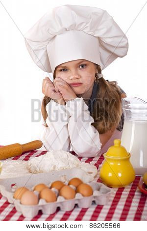 Beautiful little baby dressed as a cook, isolated on a white background