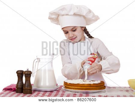 Cooking and people concept - smiling little girl in cook hat, isolated on white background