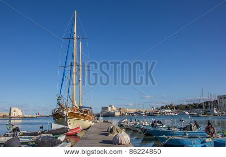 Jetty With Boats In The Harbor Of Trani
